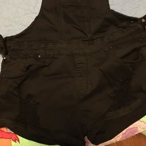 Women’s black distressed shortalls